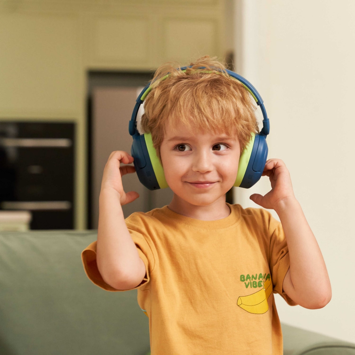 A boy wearing iClever Kids Headphones BTH20